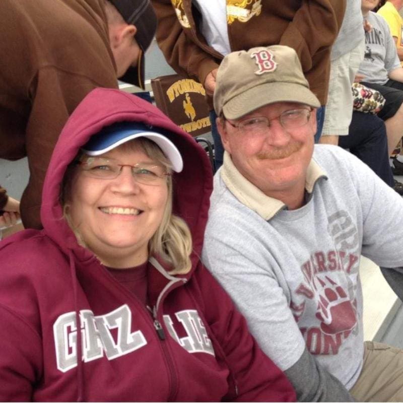 An image of Barb and her husband Mike at a Griz game.