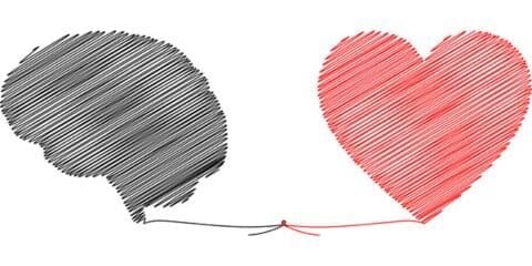 A sketch of a brain made of black string and a heart made of red string that each has a piece that meets the other and ties together.