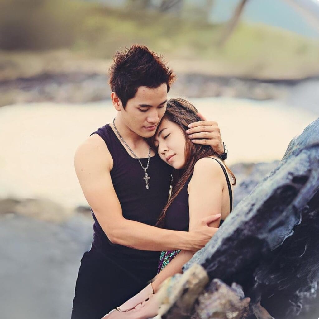 Image of young Asian couple in a warm embrace, depicting the depth of emotional soul ties. 