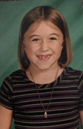 Kristin Oesterle, school photo as a young girl, childhood resilience