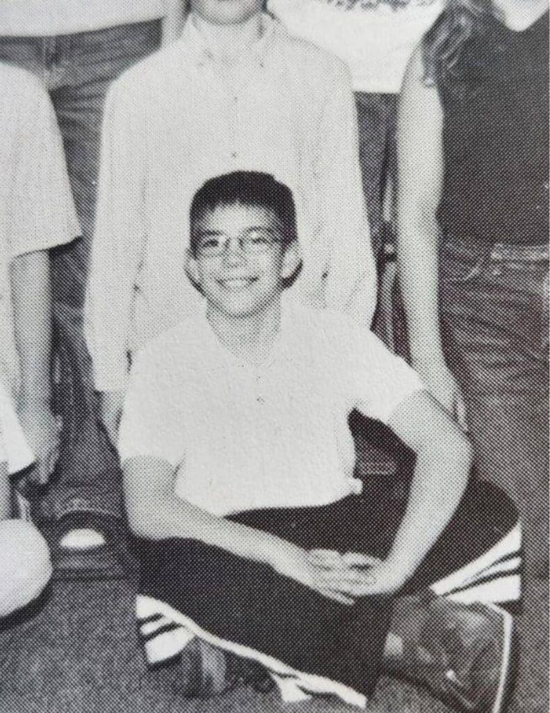 Jeremy in 6th grade, pictured with a boot on after one of his many surgeries due to being a tbi survivor. 