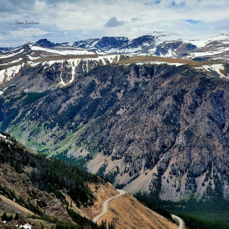 A photo the author took of the mountains and the winding road miles below representation of her self-healing journey.