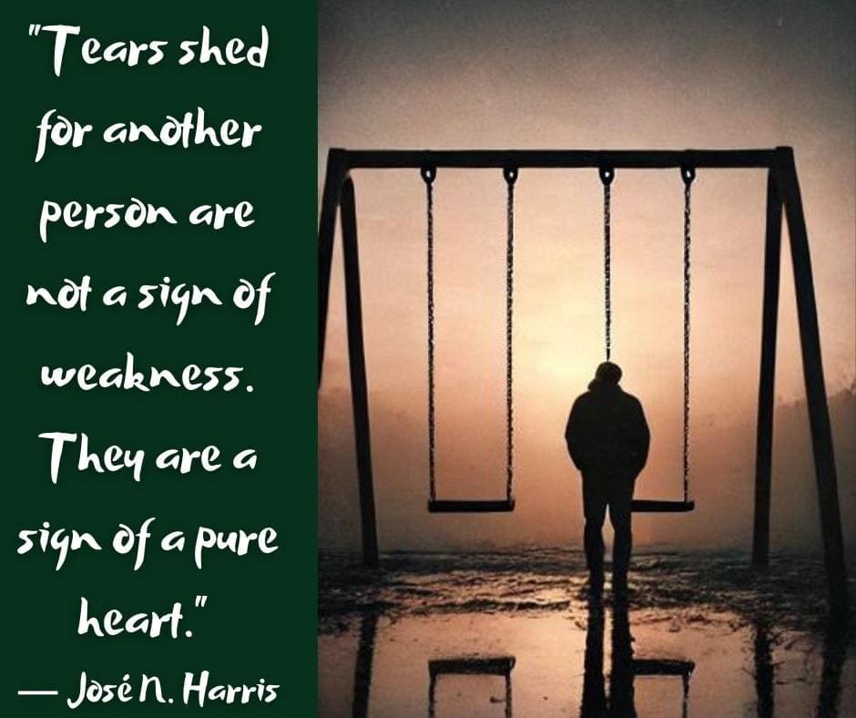 AI-image of a shadowy figure standing alone in the rain in front of two empty swings, and a quote that says "Tears shed for another are not a sign of weakness. They are a sign of a pure heart." — Jose N. Harris