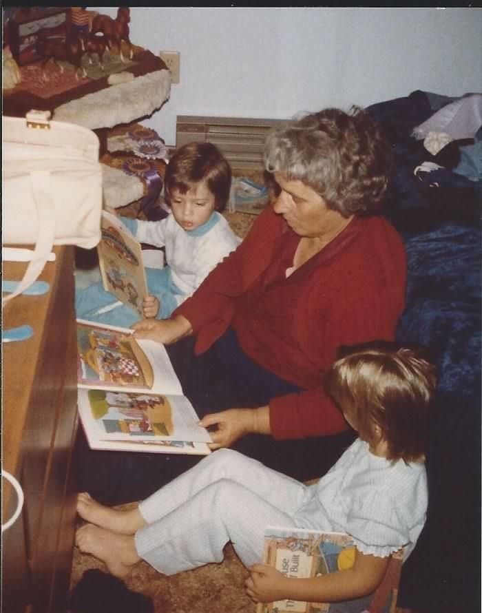 Young Donna and Michael being read bedtime stories by Grandma.