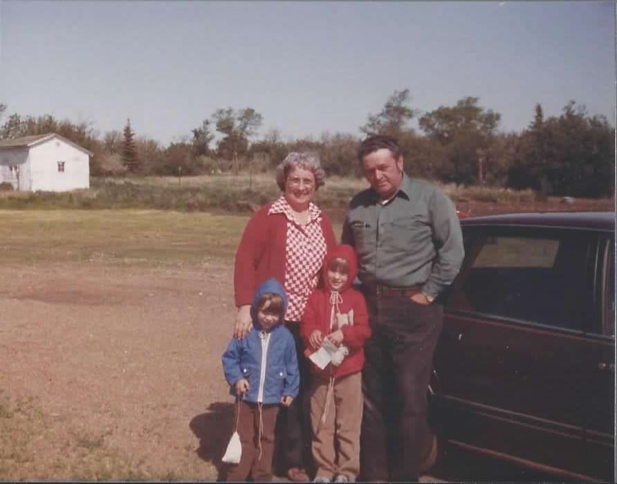 Young Donna and Michael at the farm with their grandparents.