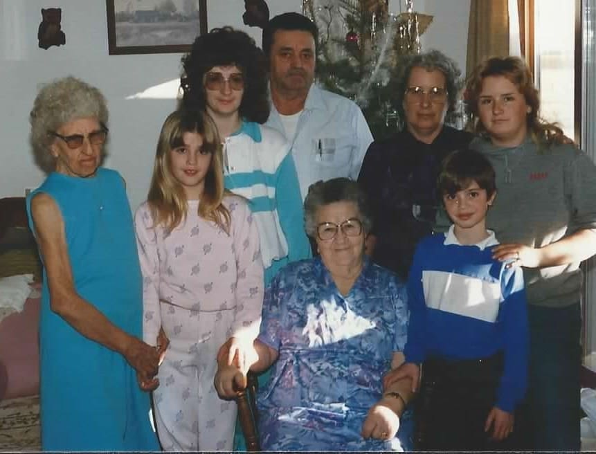 Young Donna and Michael with their mom, grandparents, aunt, and two great grandmas.