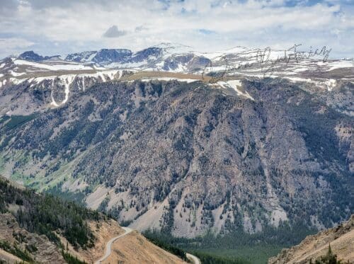 A shot taken from the top of a mountain looking at the winding highway below. Photo taken by the author.