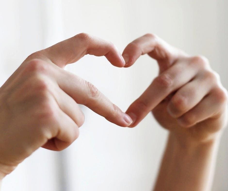 Two hands forming a heart shape 